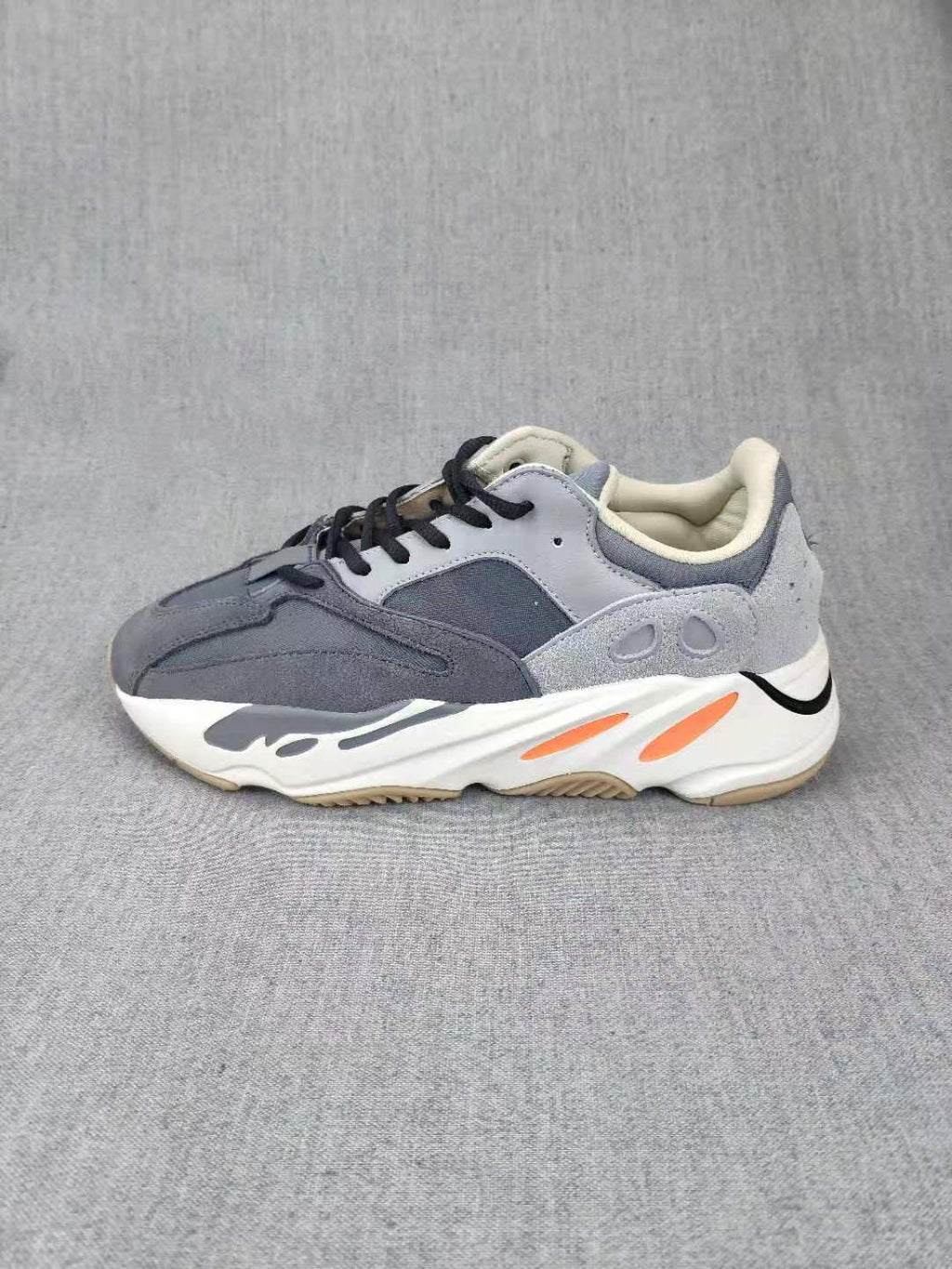 700 Grey Lifestyle Sneakers with Orange Accents