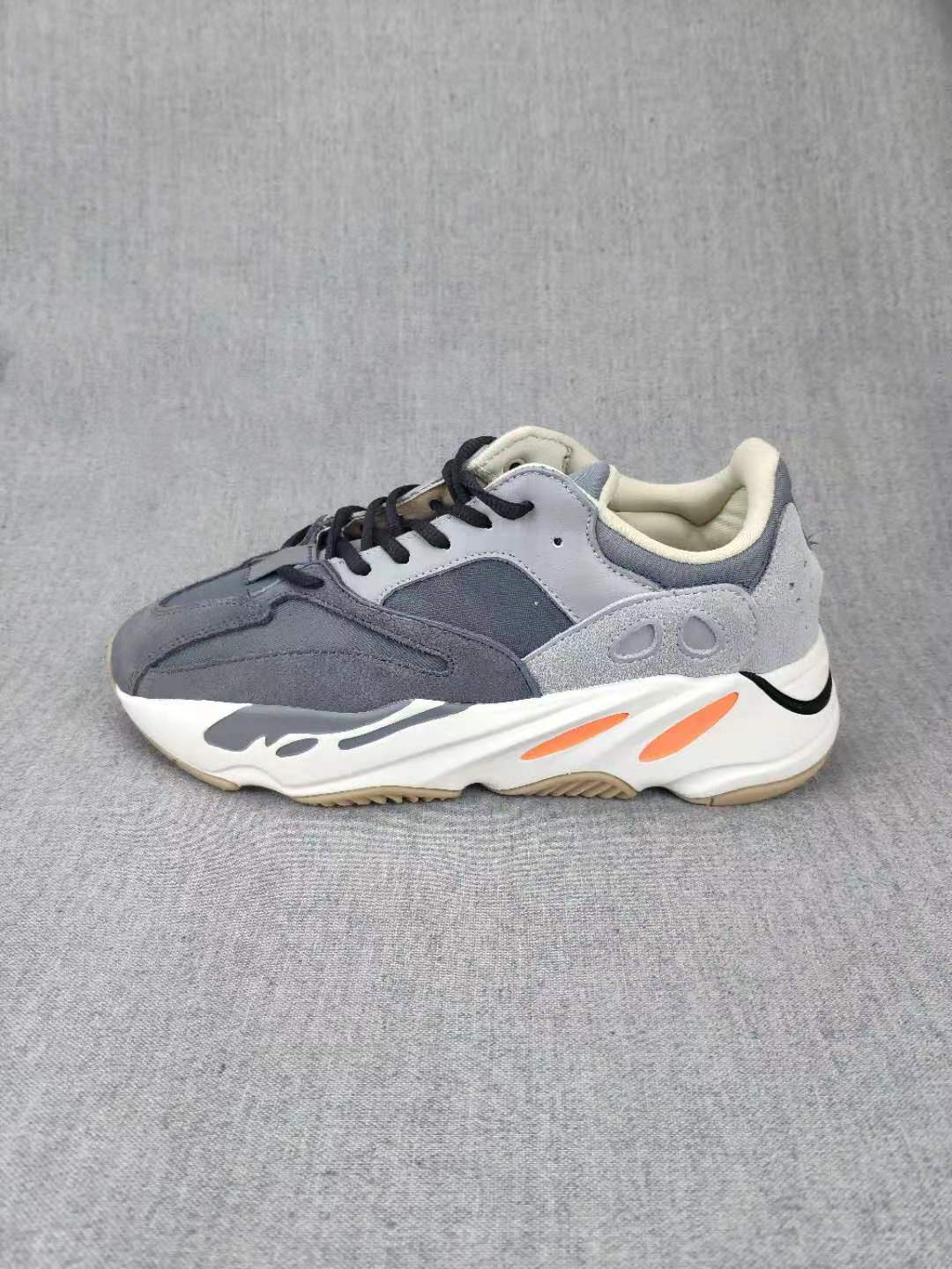 700 Grey Lifestyle Sneakers with Orange Accents