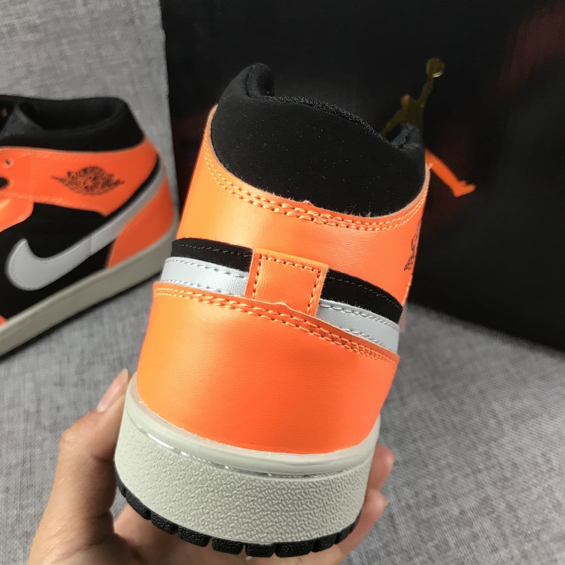 Air Jordan 1 Mid Sneakers in Black, Orange and Grey 554724-062