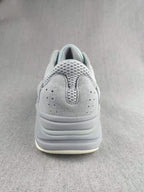 700 Gray and Coral Low-Top Sneakers