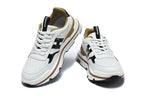 Hermès White and Black Low-Top Sneakers with Brown Trim