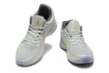 Nike Kyrie Low Basketball Shoes in Gray and Gold