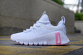 Nike Free Sneakers in White and Pink