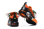 Nike Air Max Plus Sneakers in Orange and Black