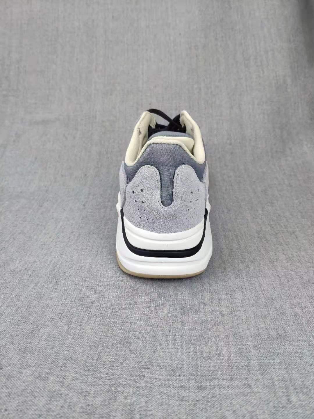 700 Grey Lifestyle Sneakers with Orange Accents