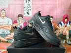 Nike Black Low-Top Sneakers with Metallic Swoosh