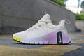 Nike Free Sneakers in White and Purple