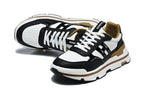 Hermès Black and White Low-Top Sneakers with Brown Trim