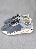 700 Grey Lifestyle Sneakers with Orange Accents