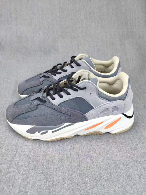 700 Grey Lifestyle Sneakers with Orange Accents