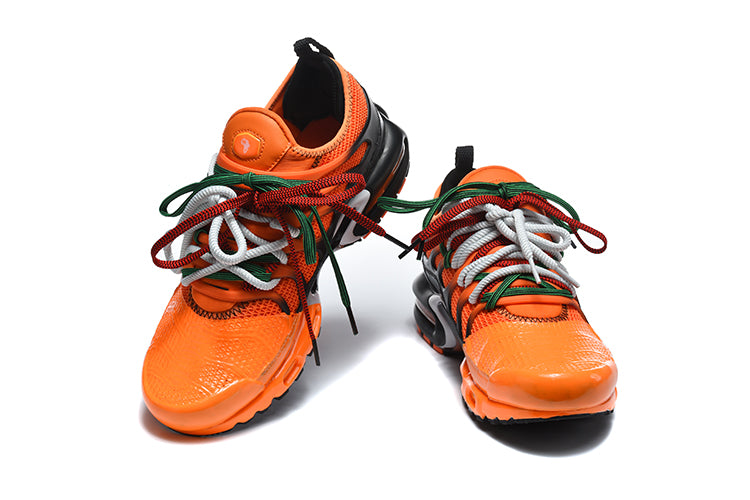 Nike Air Max Plus Sneakers in Orange and Black